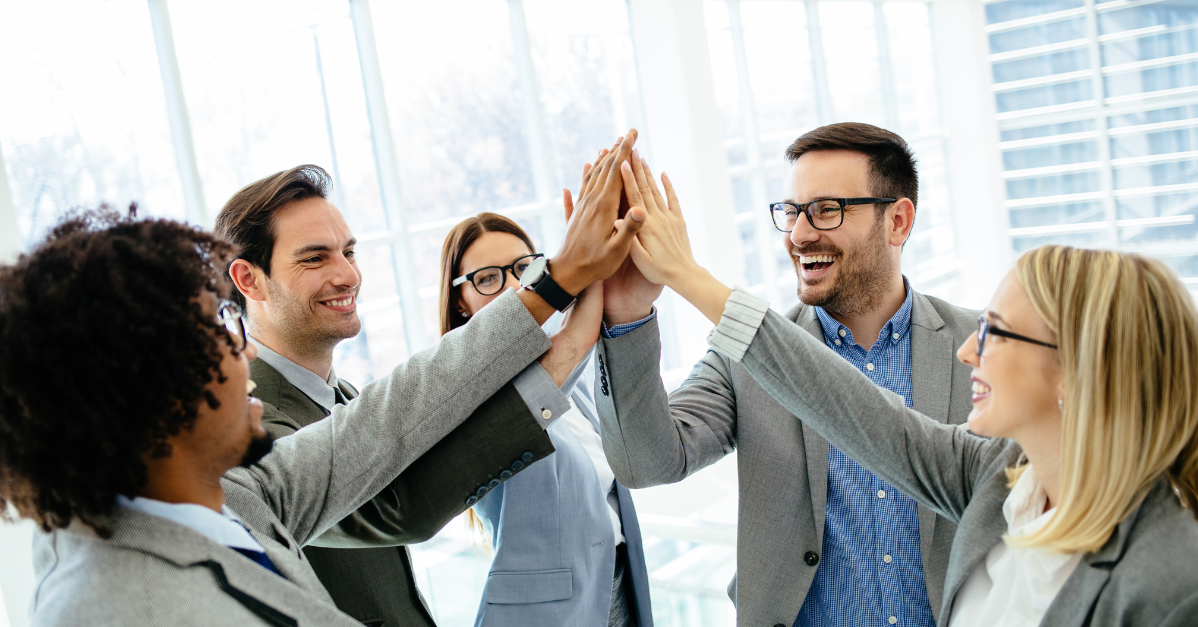 Team of professionals successfully completing a data migration project with support from PLM consultant xLM Solutions